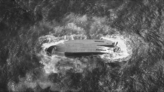 Searchers find body of 1 of 6 missing crew members from ship that overturned during typhoon