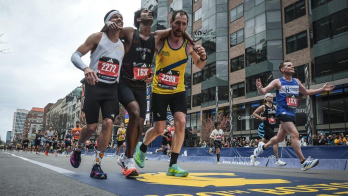 Man who helped fellow runner across Boston Marathon finish line says it was natural instinct to help