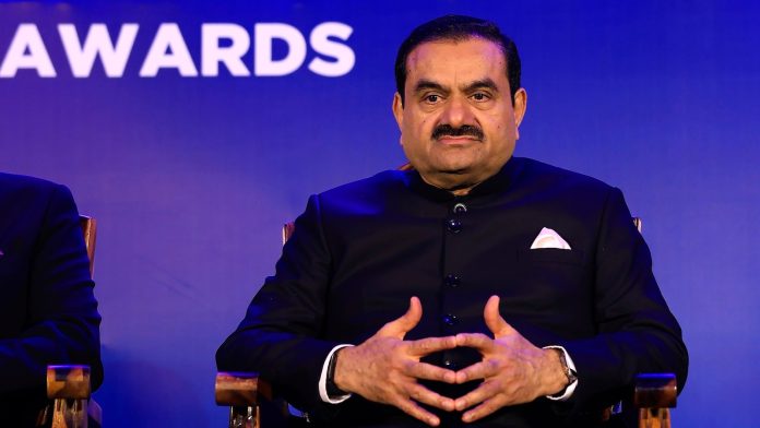 US agrees to settle lawsuit that accused Indian billionaire of hiding alleged scheme