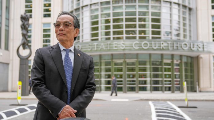 He's accused of running a Chinese spy outpost. His lawyer says it was a place to play ping-pong