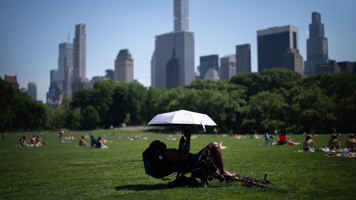 Eastern US sweats through another hot day before rain, cold move in