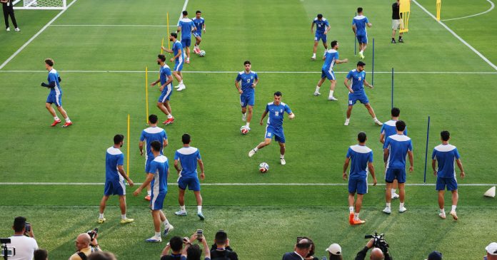 One day after peace agreement, Iran takes field for World Cup