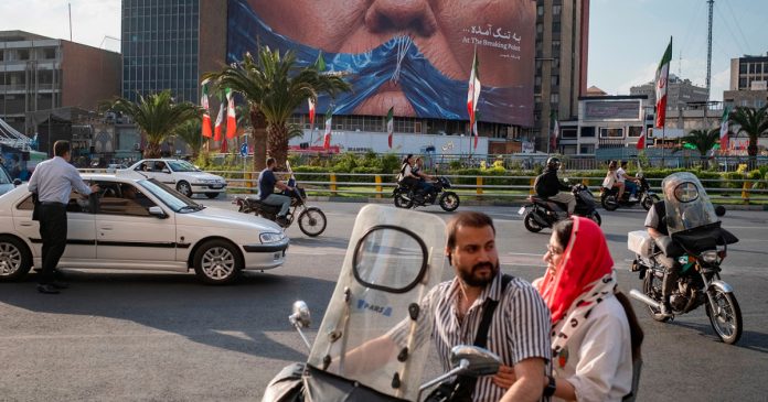 Iran ramps up propaganda war with violent billboards