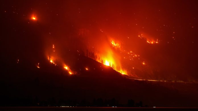 Wildfires burn across western US and Canada as residents are evacuated