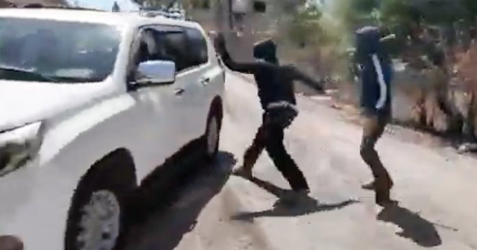 Palestinian woman and NBC News team attacked by masked Israeli settlers in West Bank
