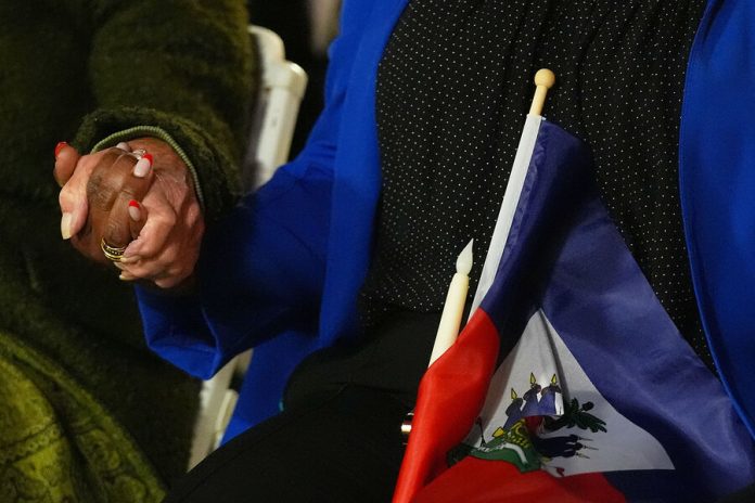 End of temporary status for Haitians in US sets off scramble for options