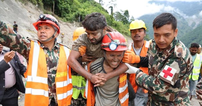 Two trapped workers are pulled alive from Nepal tunnel more than a week after deadly floods