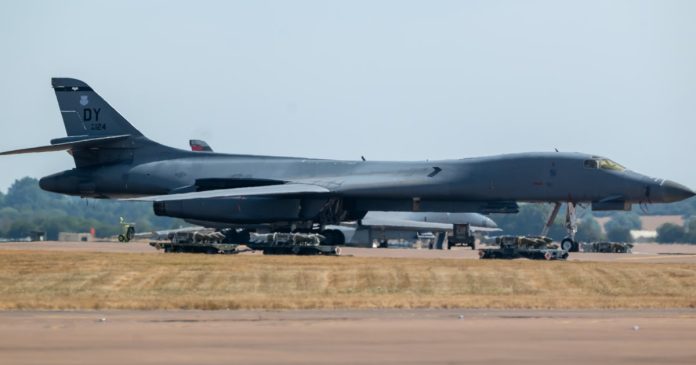 Men arrested on suspicion of explosives offences near U.S. air base in Britain as vehicles searched