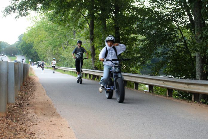 With speed, wheelies, e-bikes make cities revisit road rules
