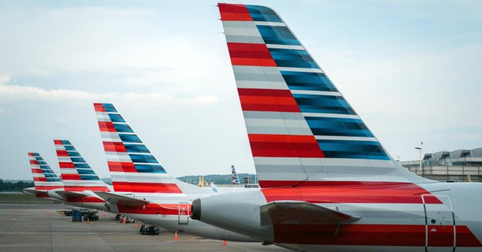 Man duct-taped to plane seat after hurling slurs and attacking other passenger, witness says