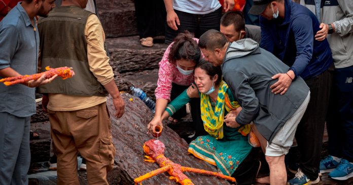 In Nepal, mourners hold symbolic cremation for missing loved ones