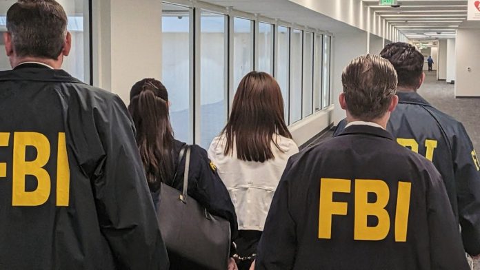 FBI arrests California woman accused of spying on Taiwan leader's family for China