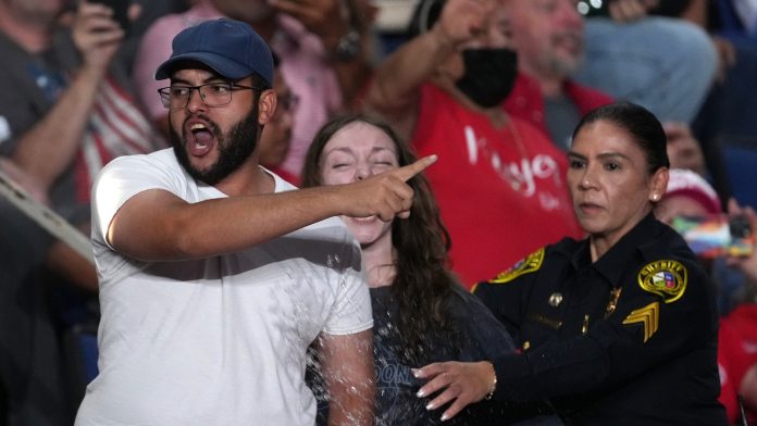 Trump interrupted by protesters as he fights to rally Texas voters behind Paxton in US Senate race